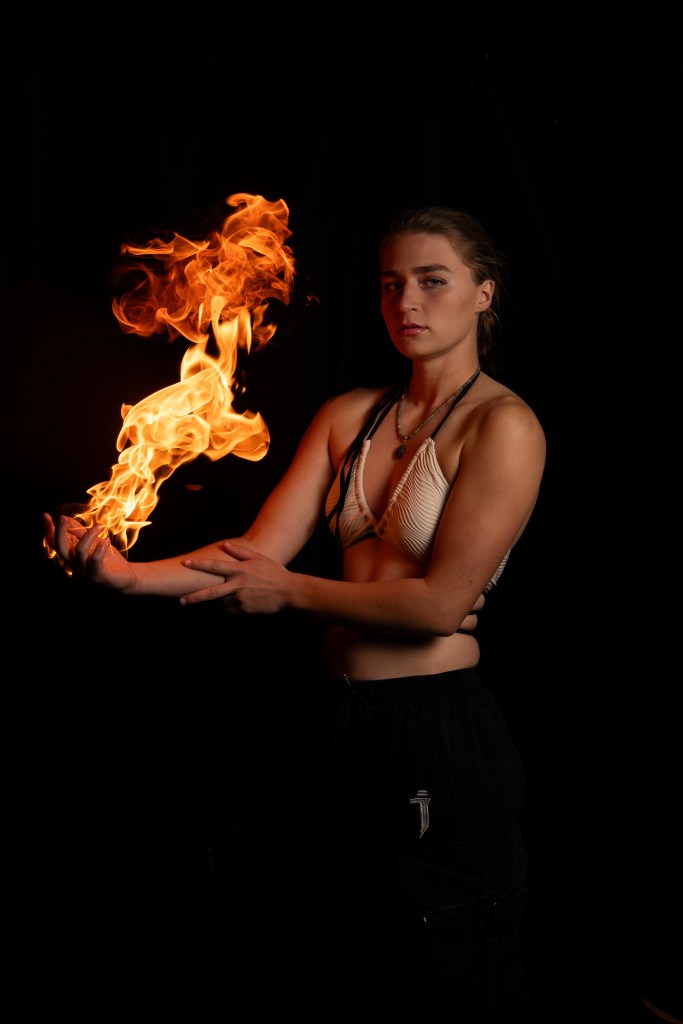Gray posing with fire in her hand